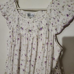 Woman's cotton nightgown with ruffle at bottom; white/purple flowered print